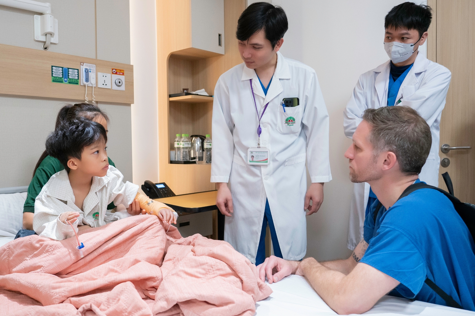 The doctor performs a post-operative examination of the patient