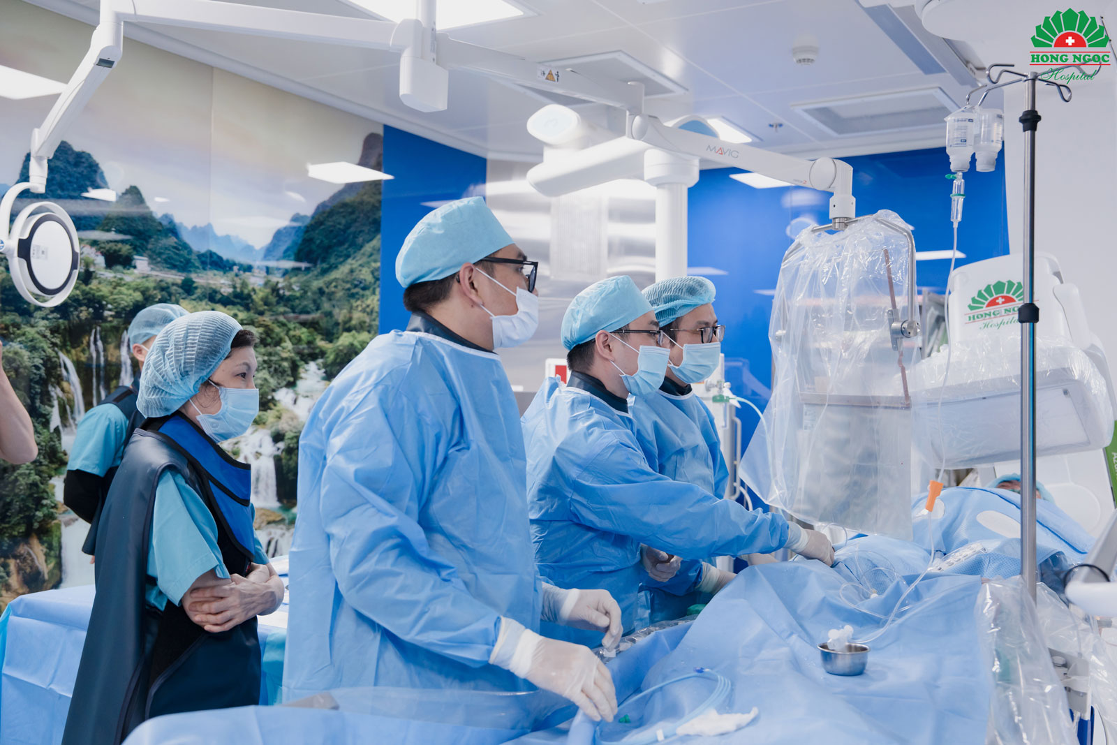 The cardiac catheterization laboratory at Hong Ngoc General Hospital during a complex interventional procedure