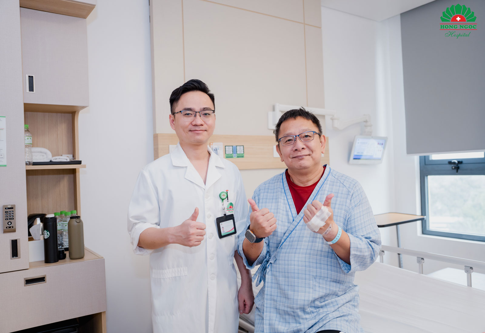 Mr. Y poses for a photo with Dr. Cong before discharge